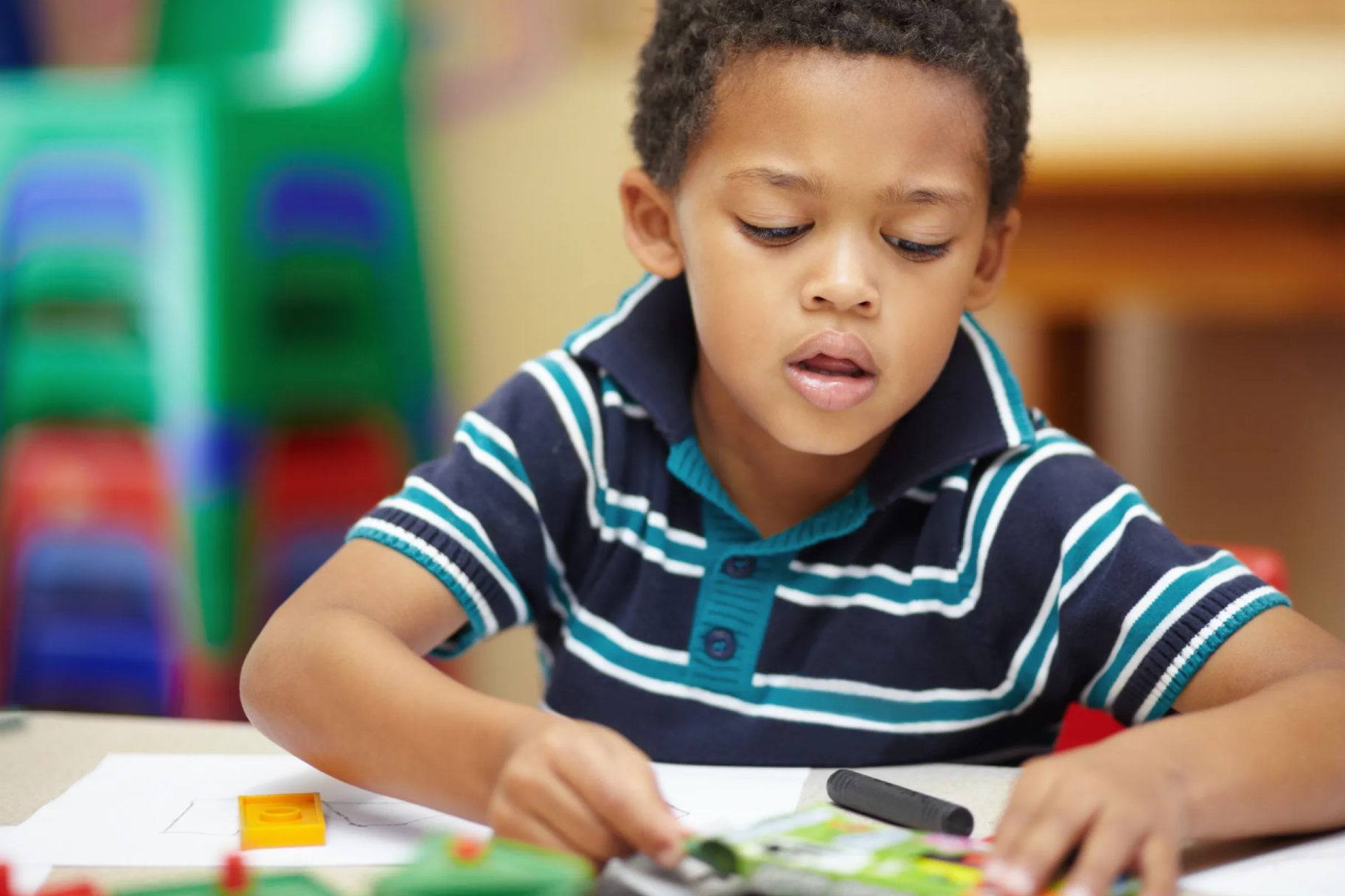 School, focus and a child drawing in a class for education, learning and creativity